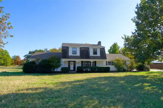 a house view with a garden space