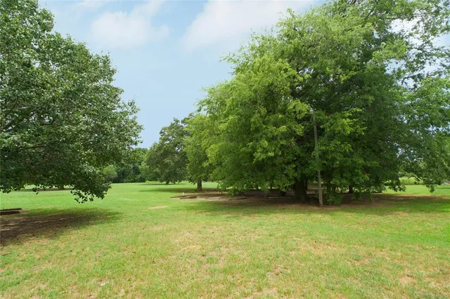 a view of outdoor space with deck and yard