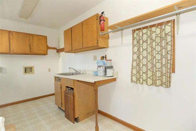 a kitchen with stainless steel appliances granite countertop a sink and a cabinets