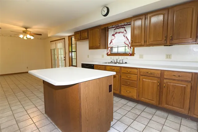 a kitchen with a stove a sink and a microwave
