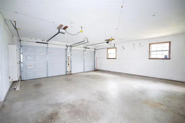 a living room with a table and chairs