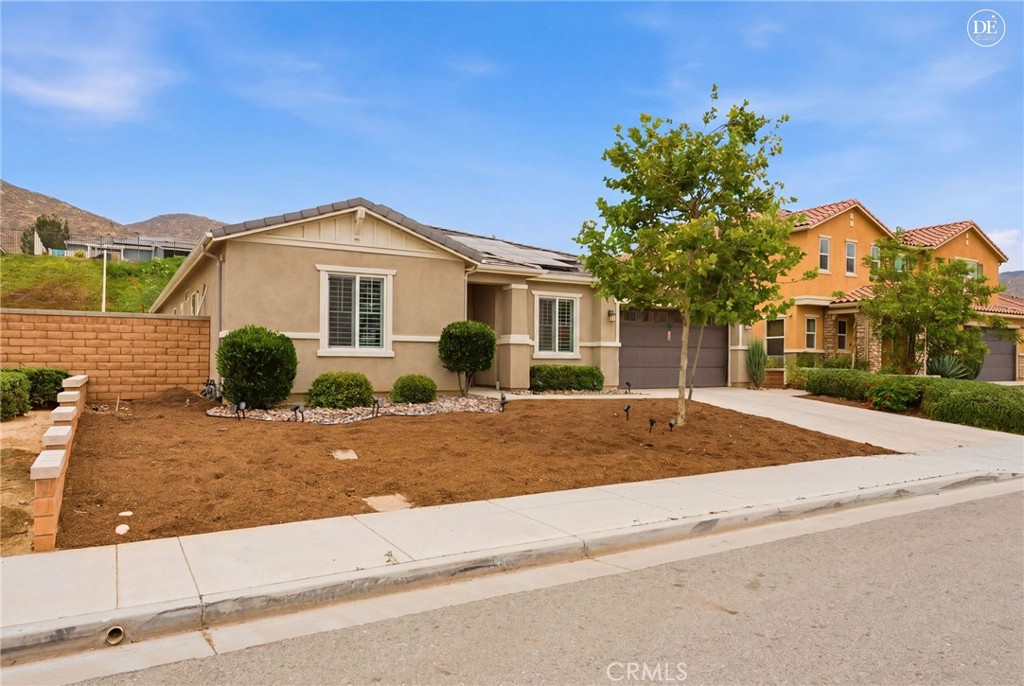 20948 Center Street Riverside, CA 92507 - Photo 6 of 92 a front view of a house with a garden