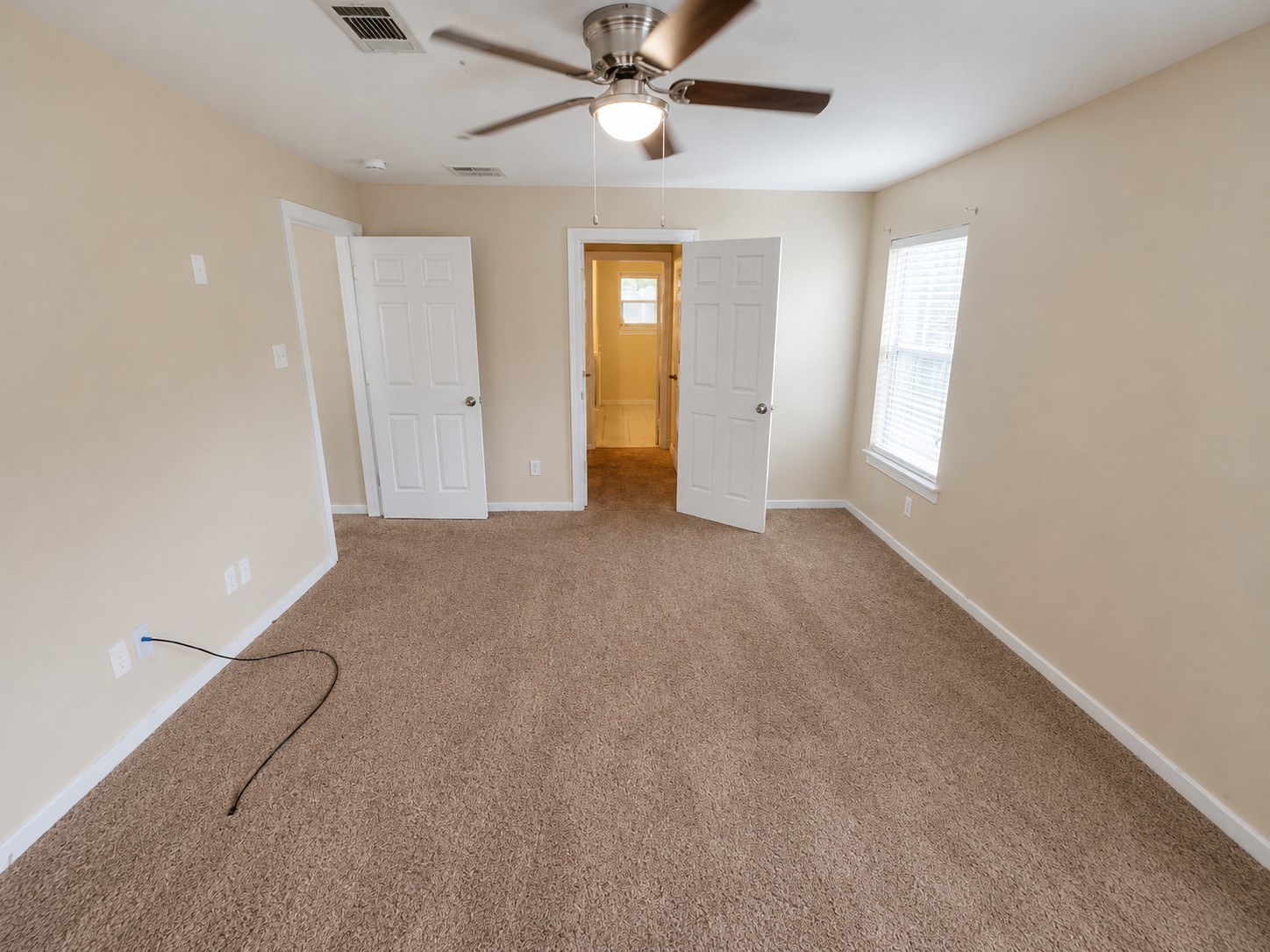 12926 Abalone Way Houston, TX 77044 - Photo 9 of 15 wooden floor in an empty room with a window