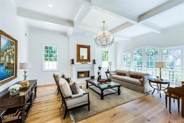 a living room with fireplace furniture and a flat screen tv