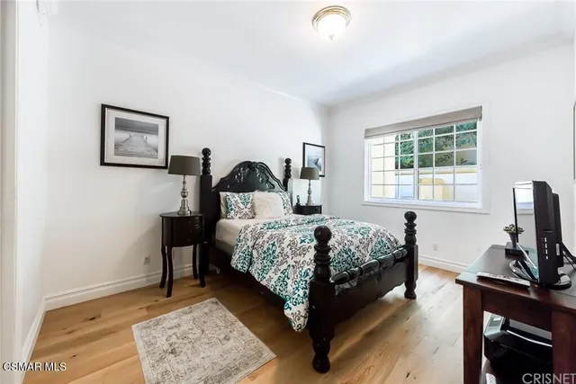 a bathroom with a granite countertop toilet a sink and mirror