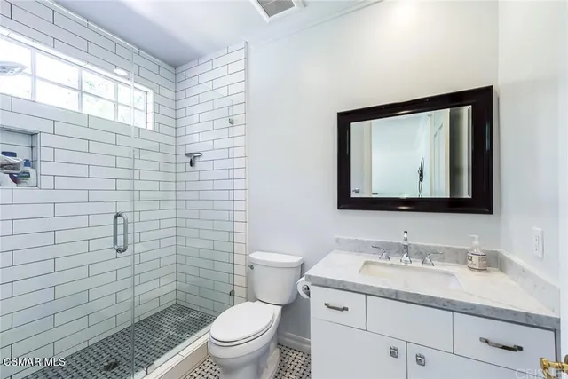 a view of a lake with a house in the background