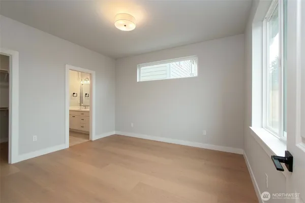 a view of empty room with windows