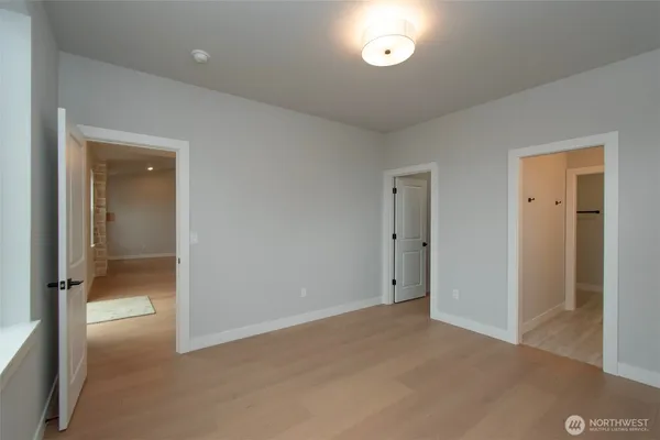 wooden floor and closet in a en suite bathroom