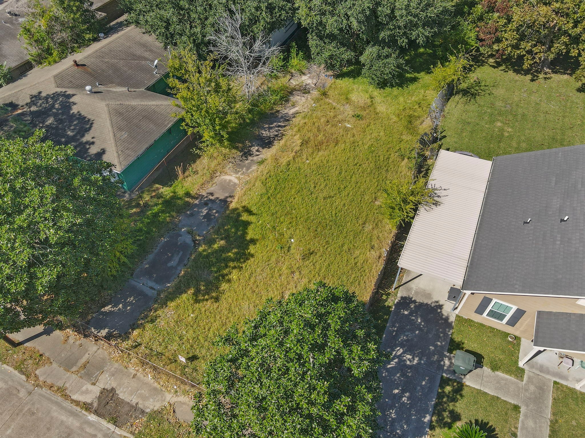 0 West 18th Street Port Arthur, TX 77640 - Photo 13 of 15 an aerial view of a house with a yard