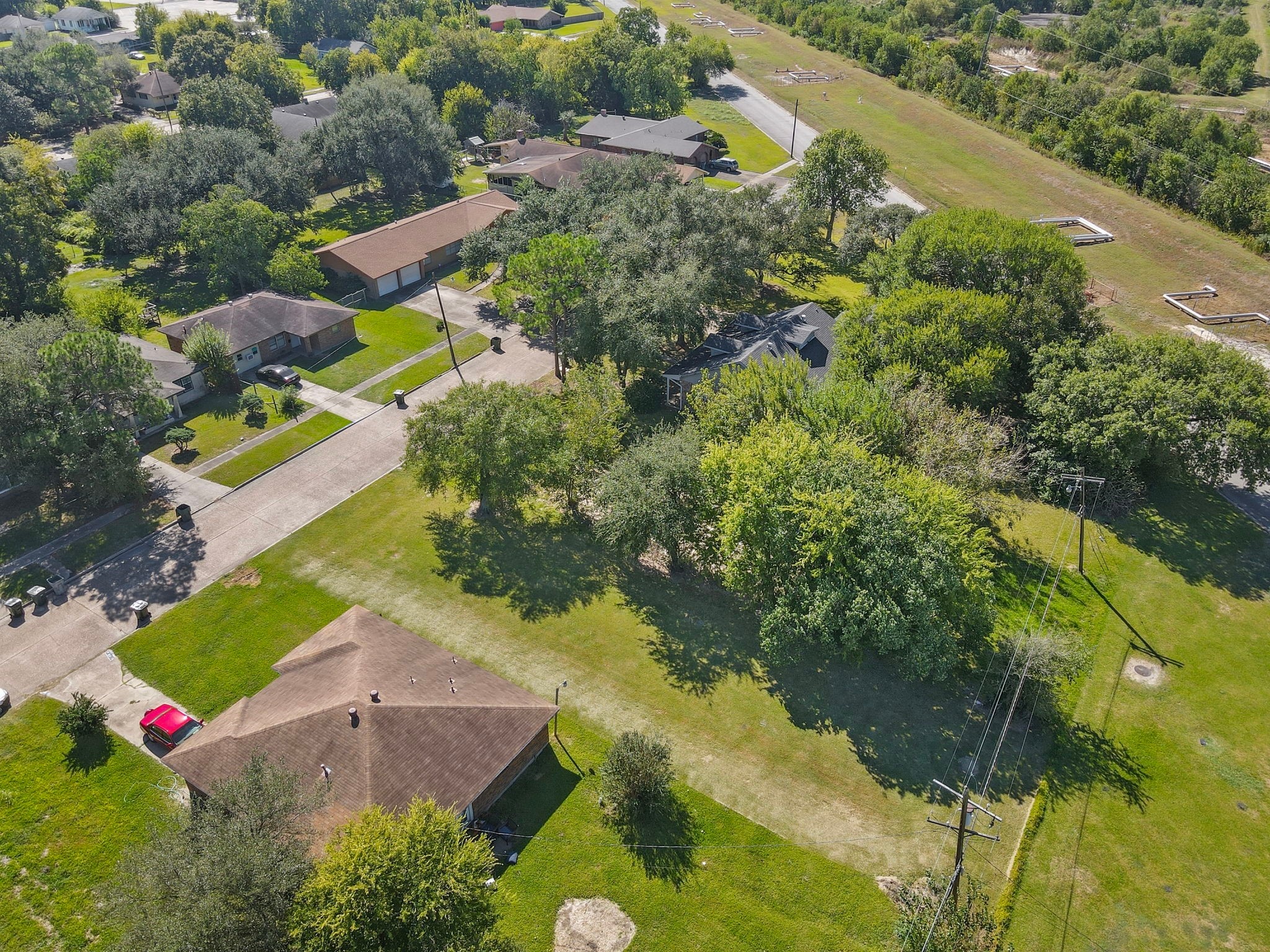 0 West 18th Street Port Arthur, TX 77640 - Photo 4 of 15 an aerial view of residential houses with outdoor space and street view