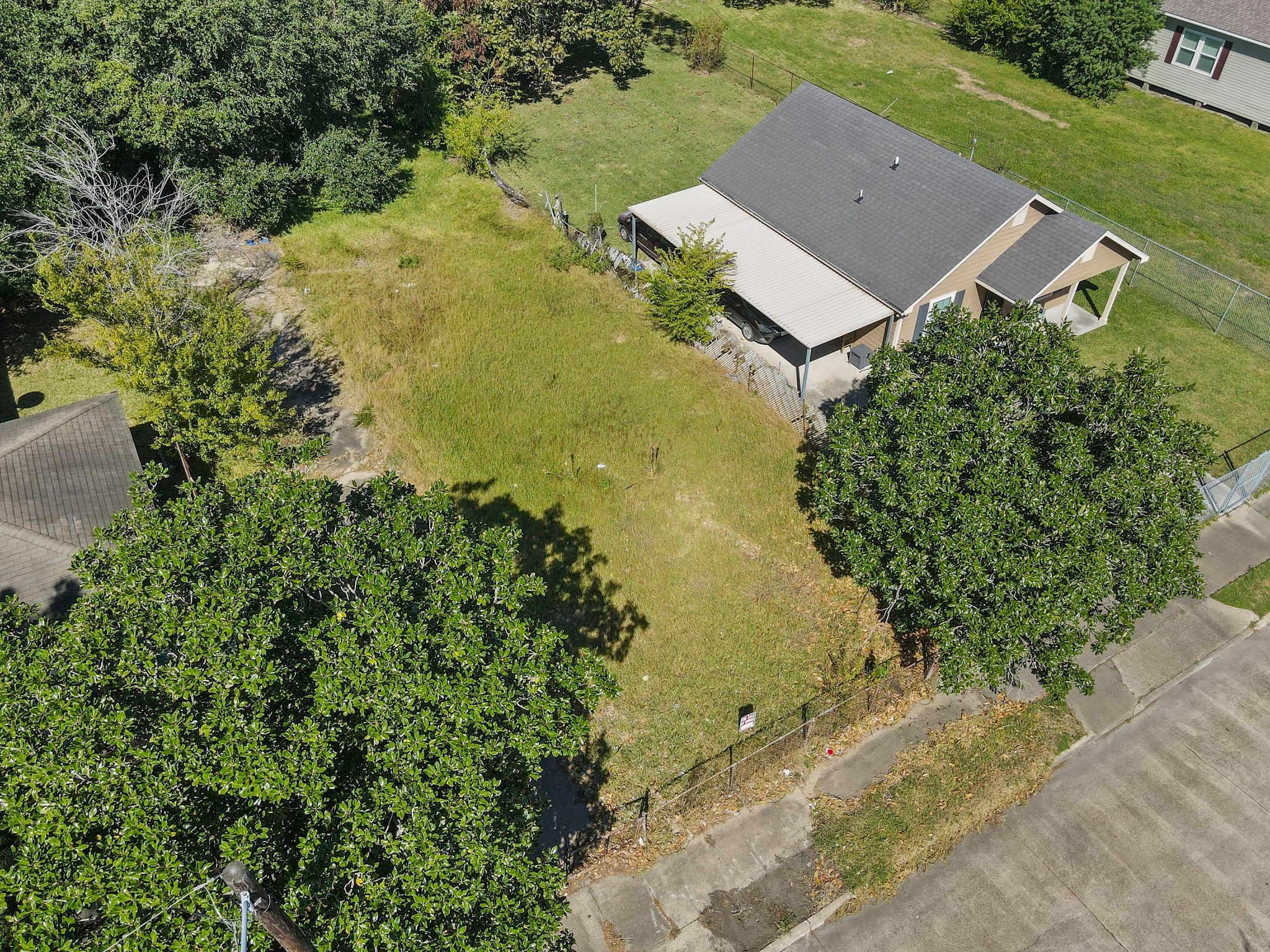 0 West 18th Street Port Arthur, TX 77640 - Photo 9 of 15 an aerial view of a house with a yard