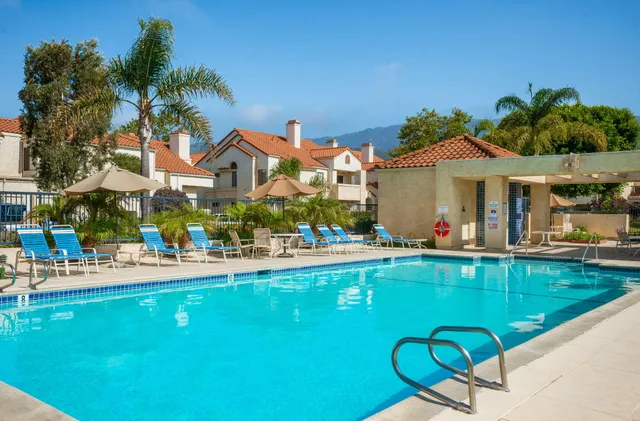 a view of a swimming pool with a patio
