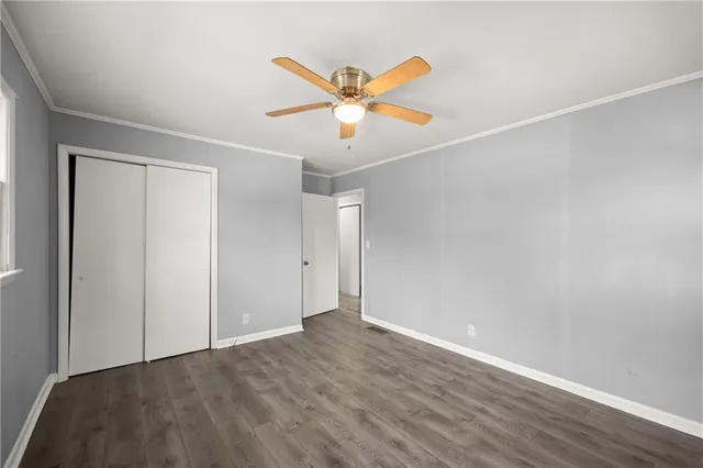 a view of a ceiling fan with wooden floor