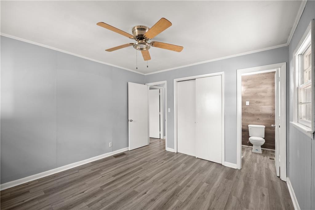 574 South Sage Street Toccoa, GA 30577 - Photo 25 of 44 a view of a room with wooden floor fan and windows