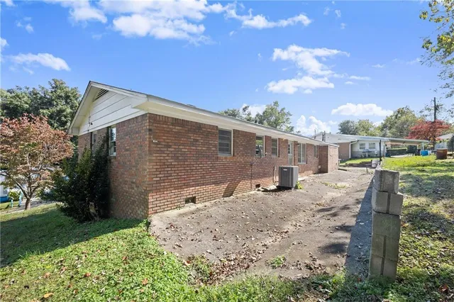 a view of a backyard with sitting area