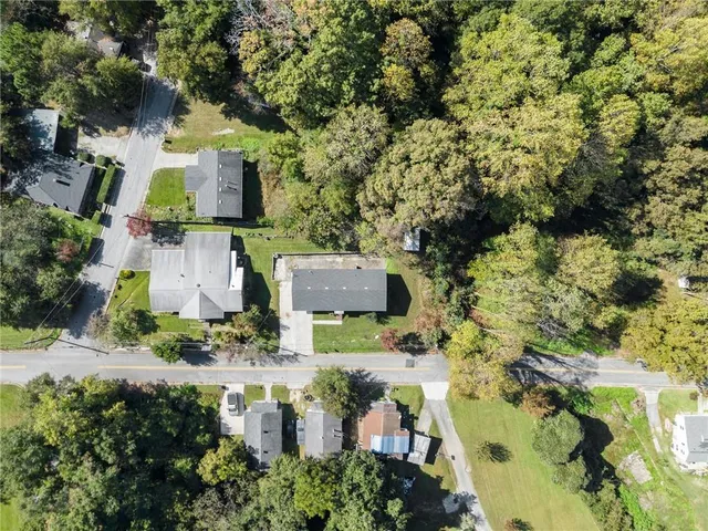 an aerial view of houses with yard