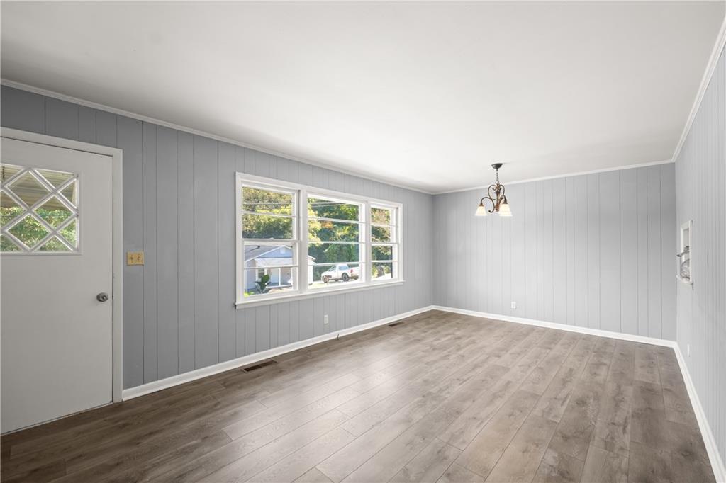 574 South Sage Street Toccoa, GA 30577 - Photo 8 of 44 an empty room with wooden floor and windows