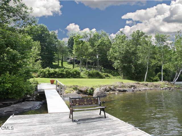 74 Lake Waramaug Road Kent, CT 06785 - Photo 1 of 1 a view of a lake with couches and wooden floor