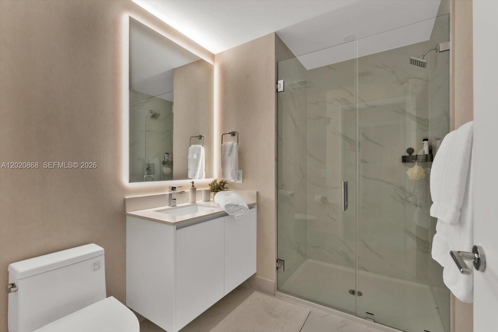700 Northeast 24th Street, Unit 1602 Miami, FL 33137 - Photo 23 of 30 a bathroom with a sink toilet and shower