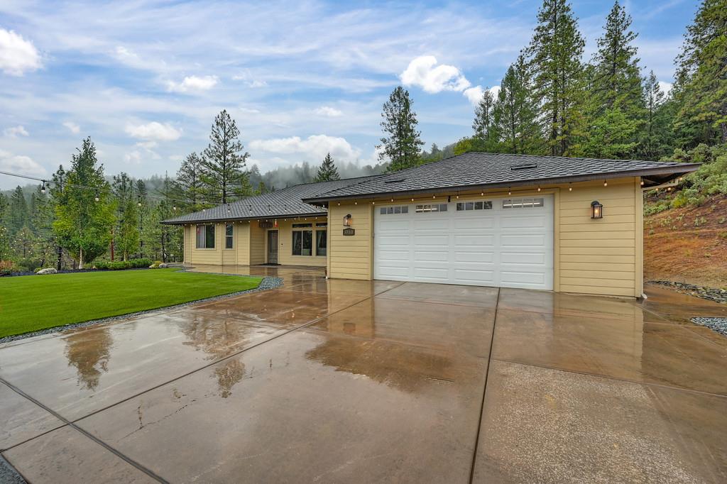 3960 Fort Jim Road Placerville, CA 95667 - Photo 59 of 64 a front view of a house with a yard and garage