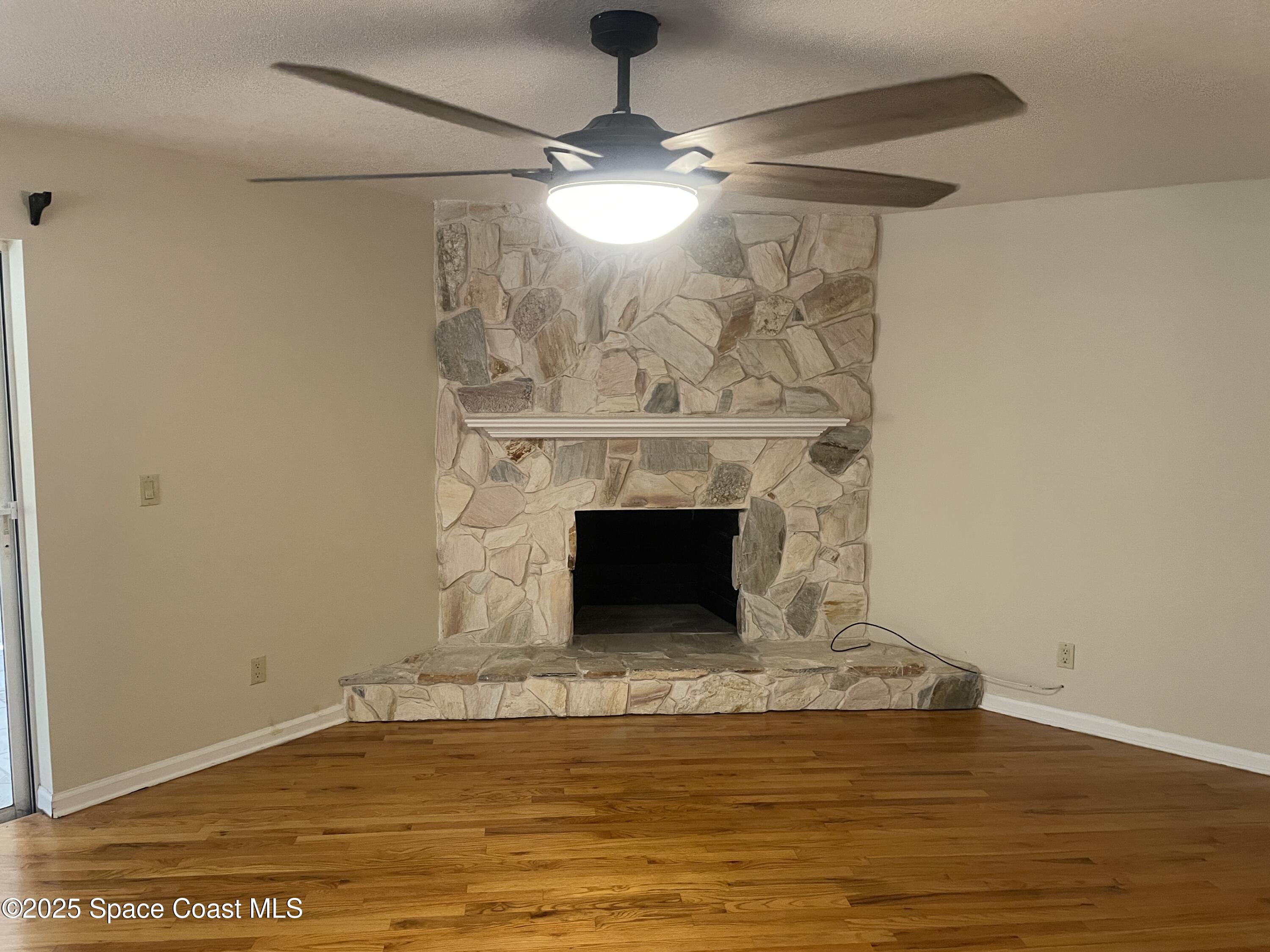 104 Jupiter Court Indialantic, FL 32903 - Photo 11 of 28 a living room with a fireplace