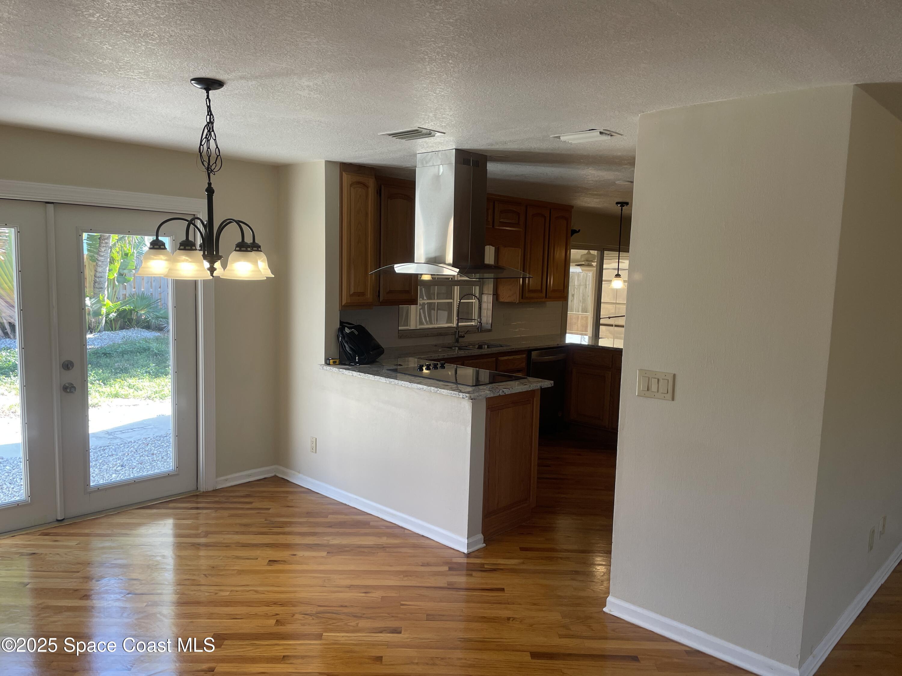 104 Jupiter Court Indialantic, FL 32903 - Photo 15 of 28 a kitchen with a sink and refrigerator