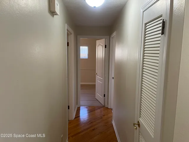 a view of a bathroom from a hallway