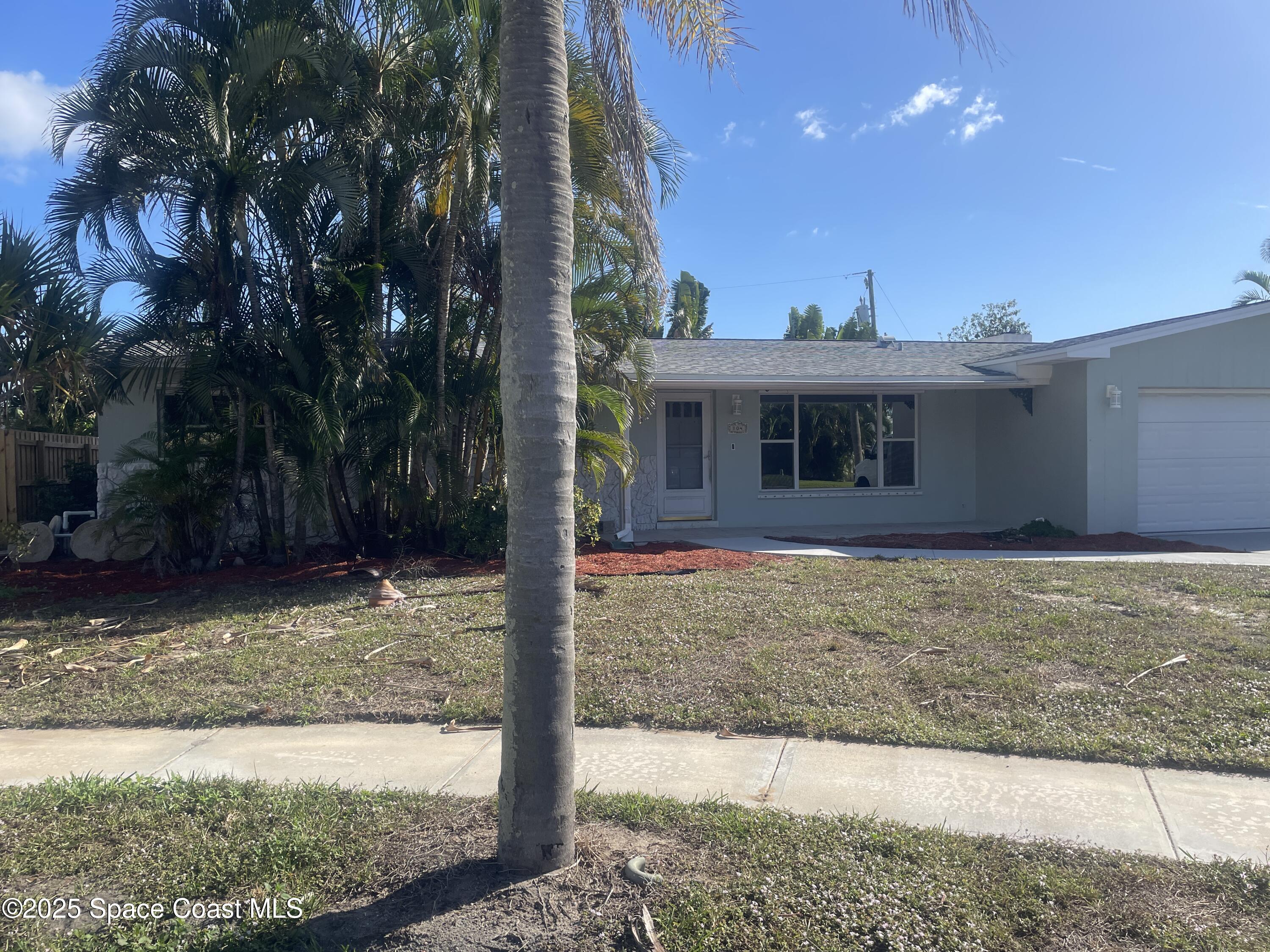 104 Jupiter Court Indialantic, FL 32903 - Photo 2 of 28 a view of a house with a yard