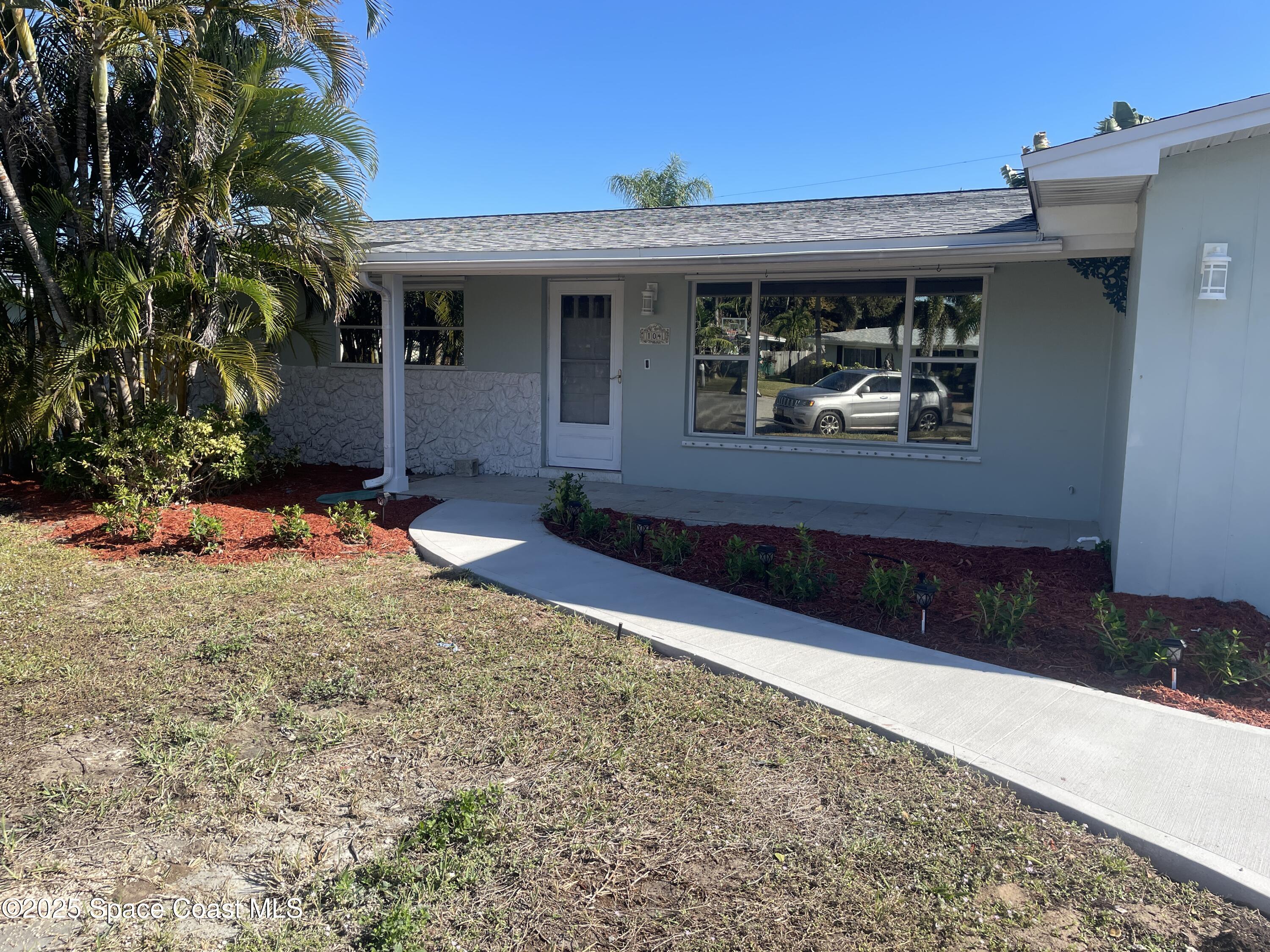 104 Jupiter Court Indialantic, FL 32903 - Photo 26 of 28 a front view of a house