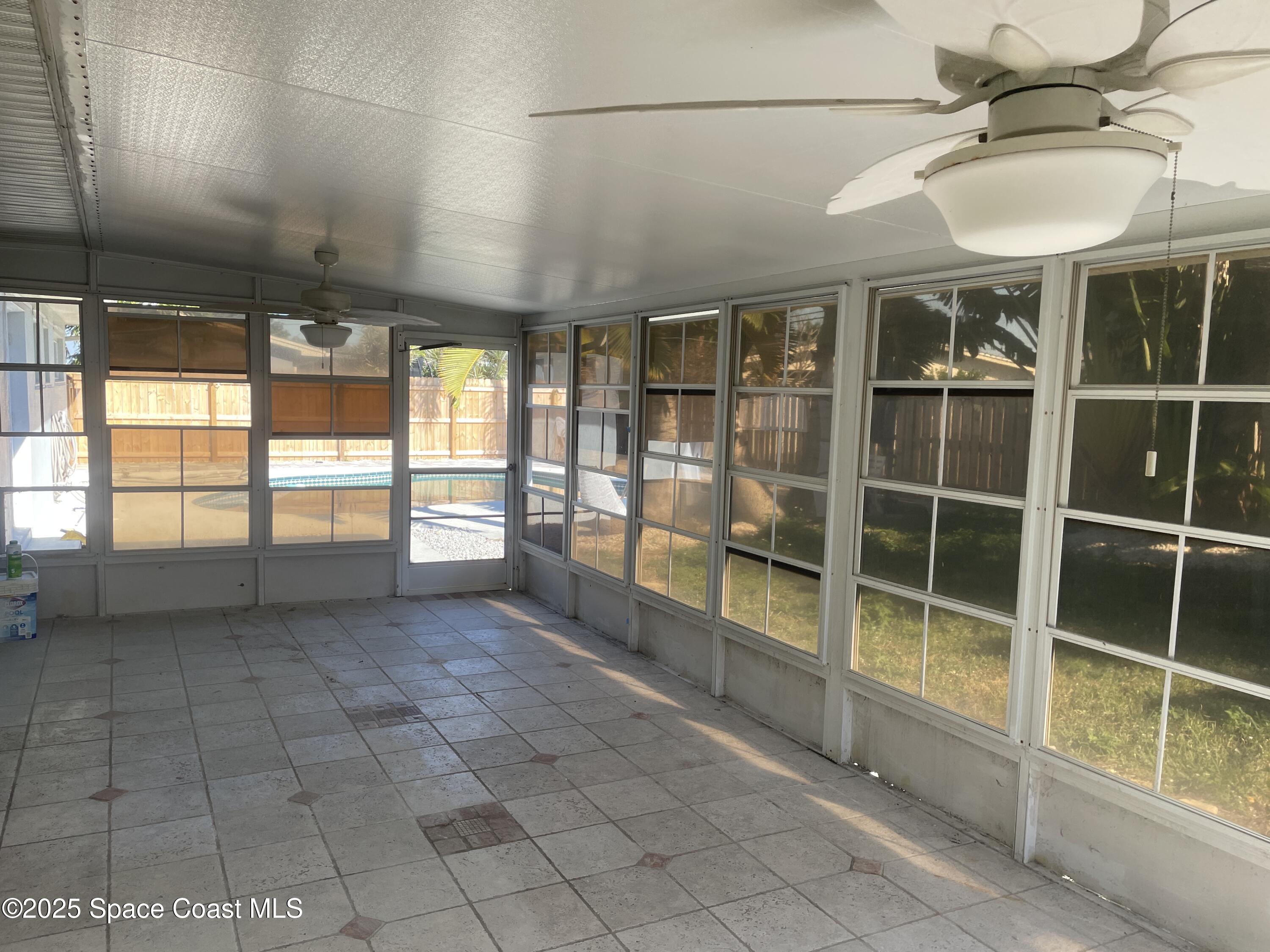104 Jupiter Court Indialantic, FL 32903 - Photo 7 of 28 a view of an empty room with a window