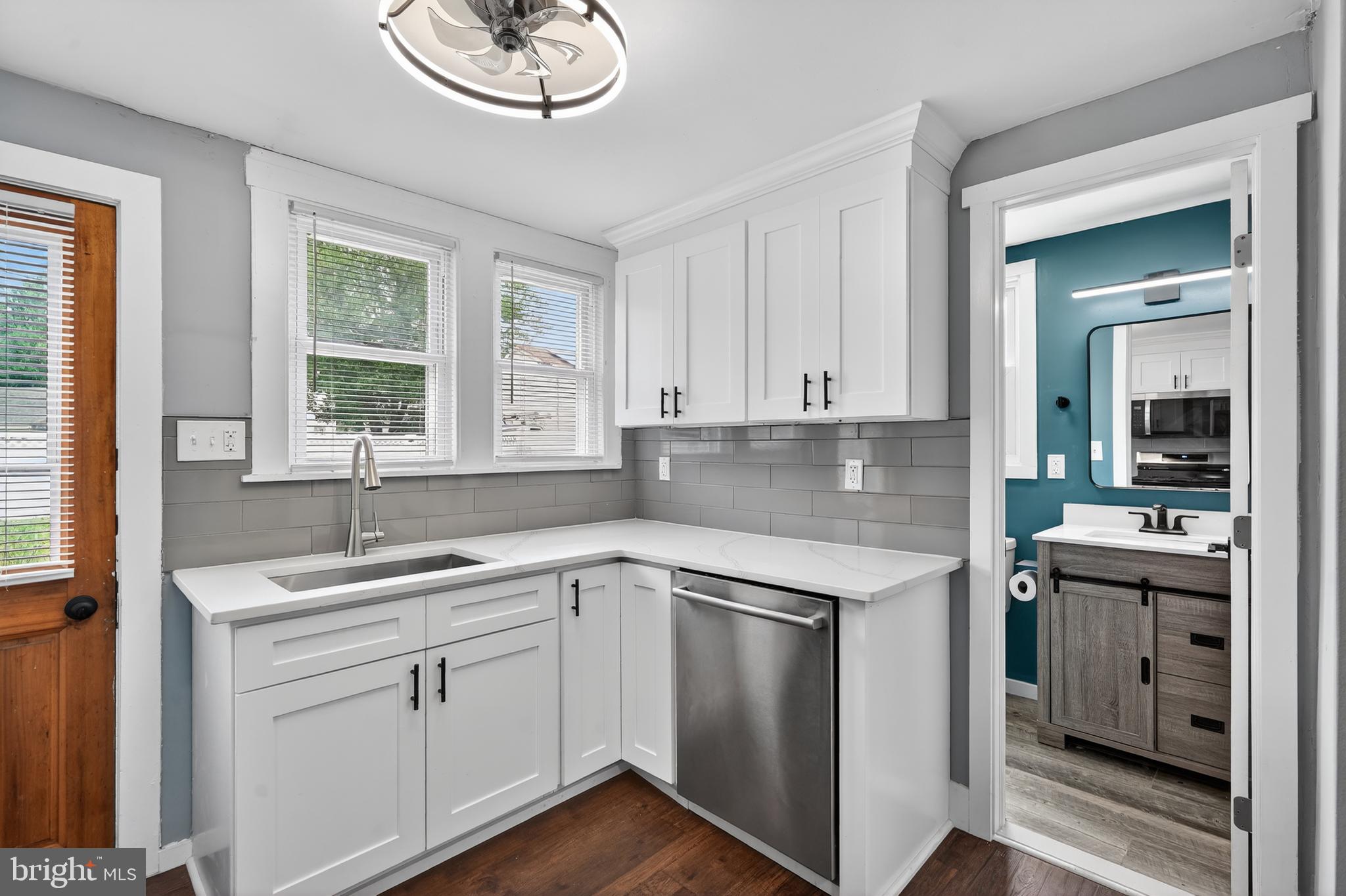 223 Noreg Place Brooklawn, NJ 08030 - Photo 18 of 36 a kitchen with a sink and cabinets
