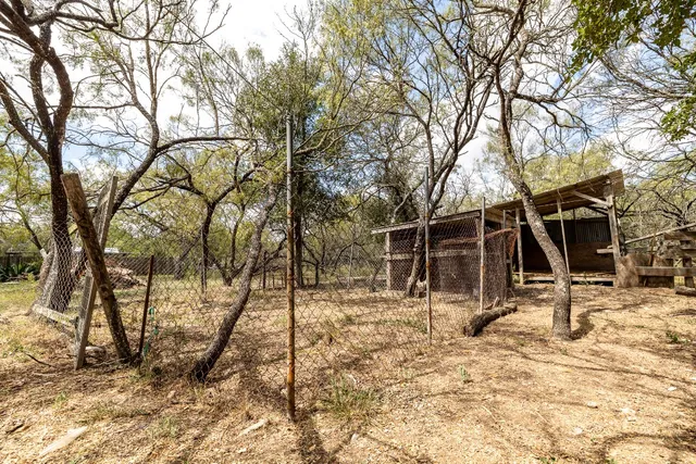 a view of a yard covered in snow