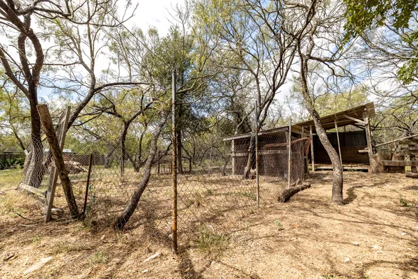 a view of a yard covered in snow