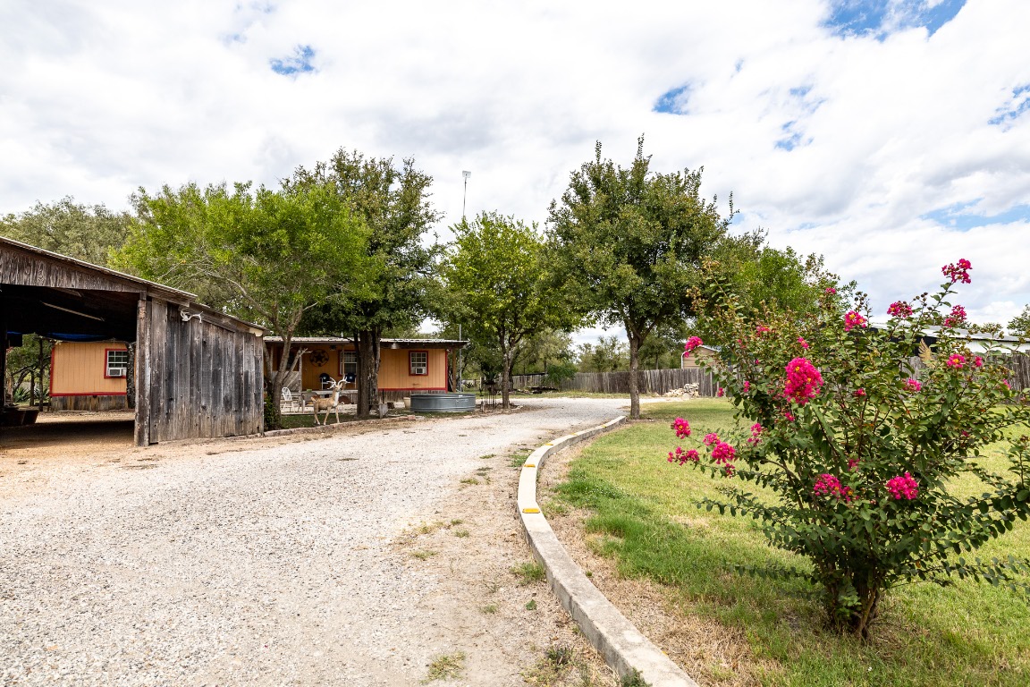 310 Union Hill Road Luling, TX 78648 - Photo 2 of 19 a front view of a house with a yard and garage