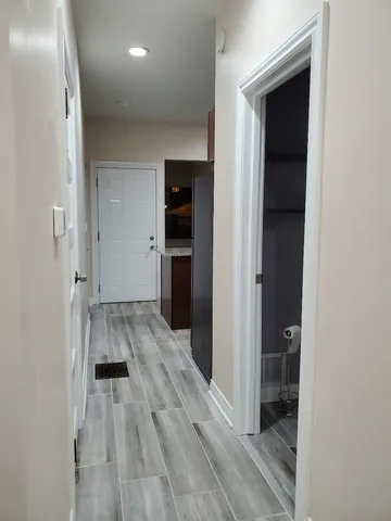 wooden floor in a hall with an entryway