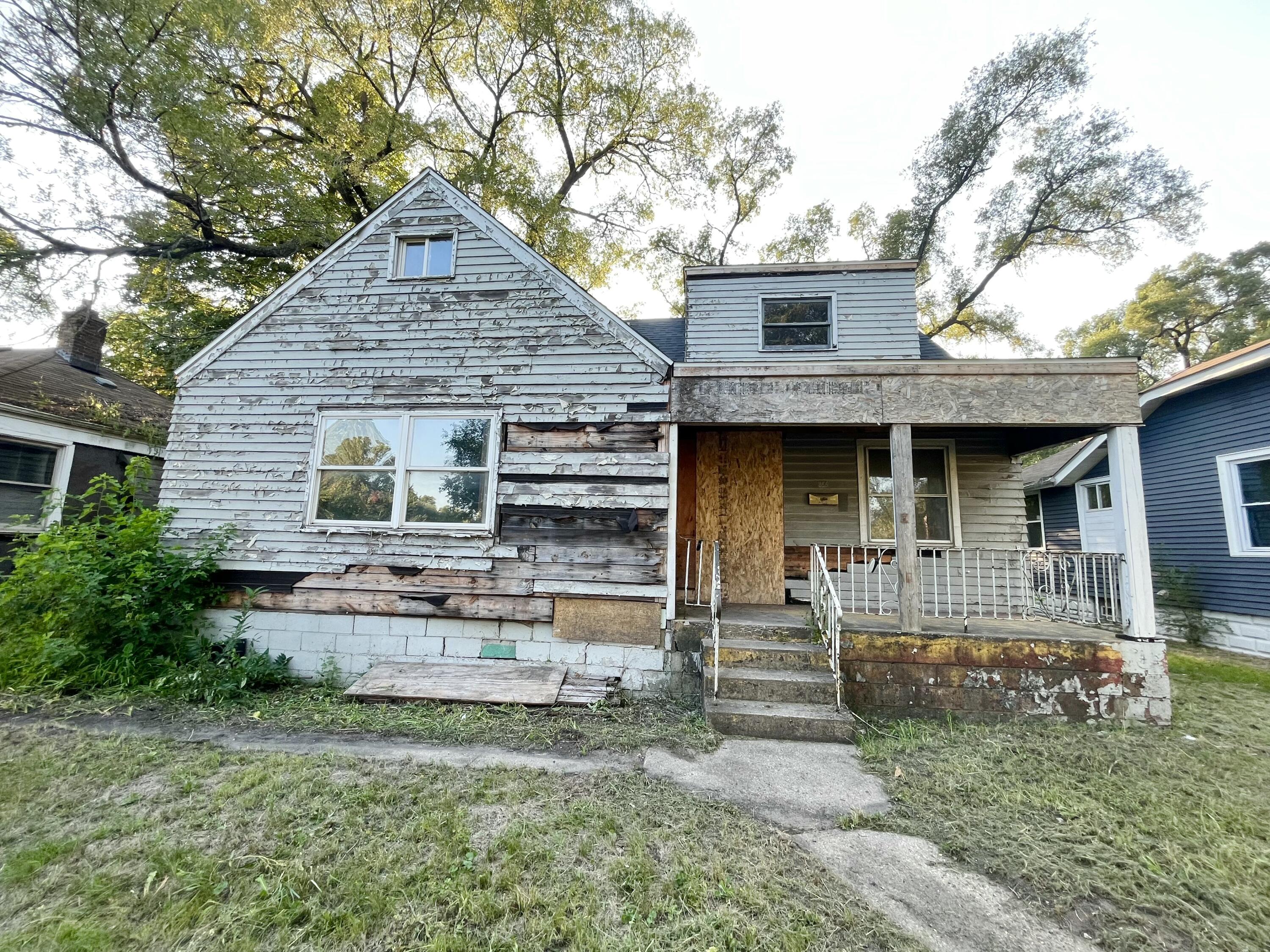 856 Kentucky Street Gary, IN 46402 - Photo 2 of 16 a front view of a house with garden