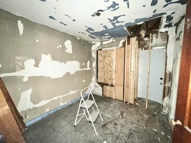 a view of a bathroom with a tub and shower