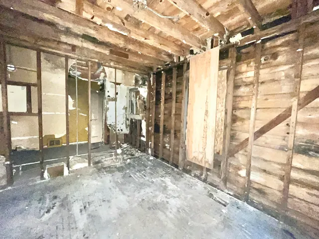 a view of a room with wooden walls