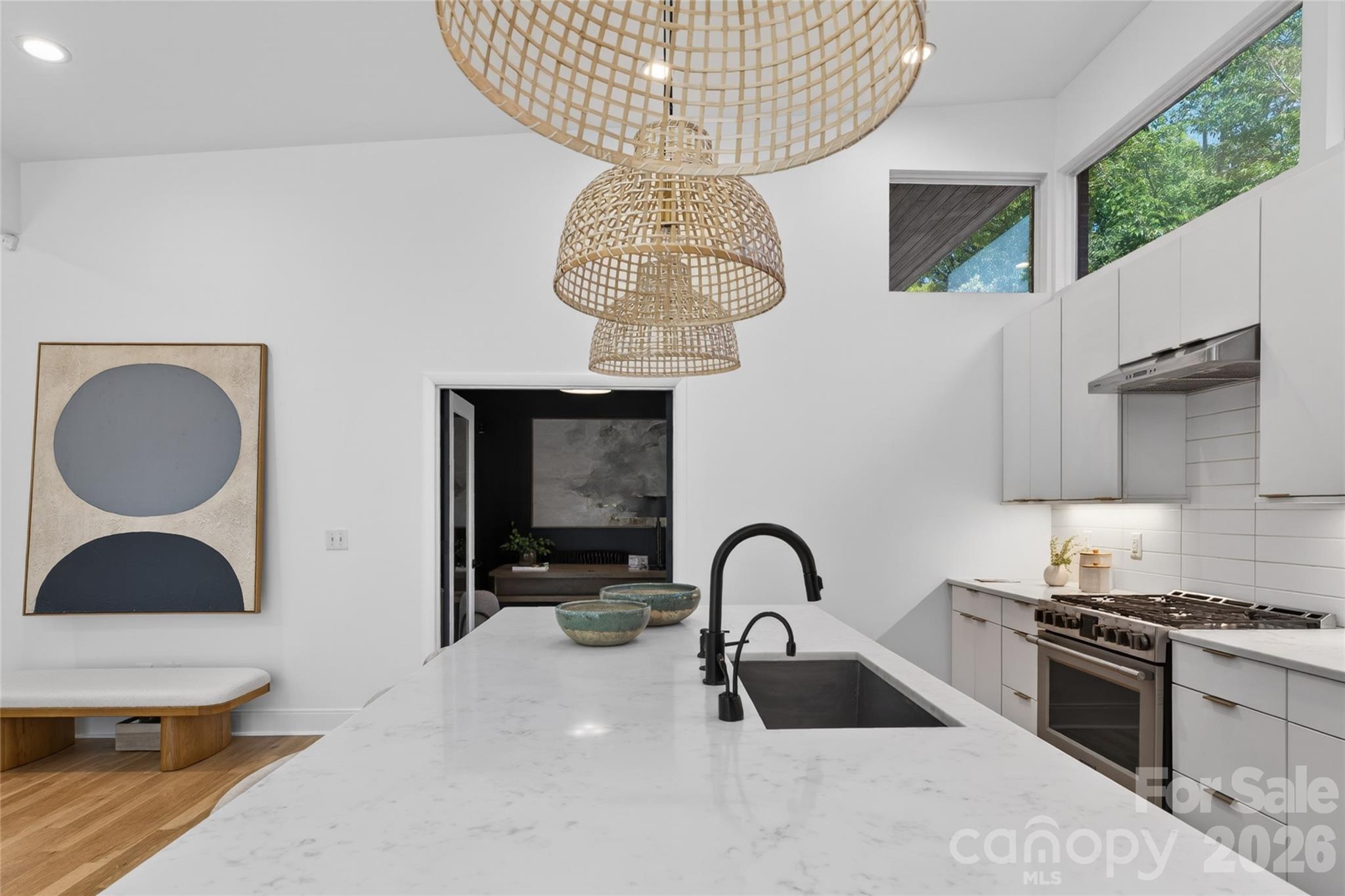 4438 Raney Way Charlotte, NC 28205 - Photo 13 of 34 a kitchen with a sink and a stove