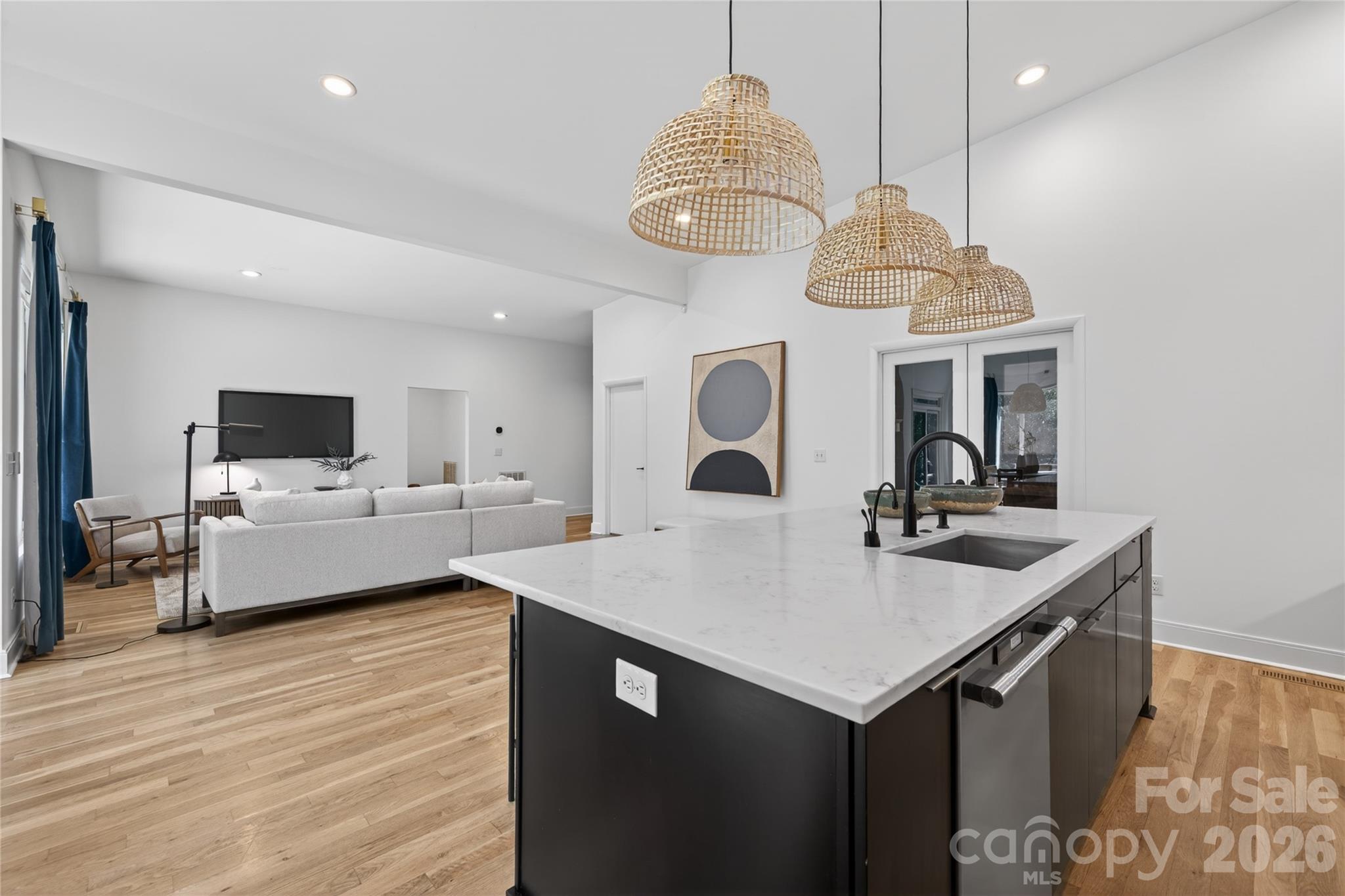 4438 Raney Way Charlotte, NC 28205 - Photo 14 of 34 a very nice looking kitchen with a table chairs and a wooden floor