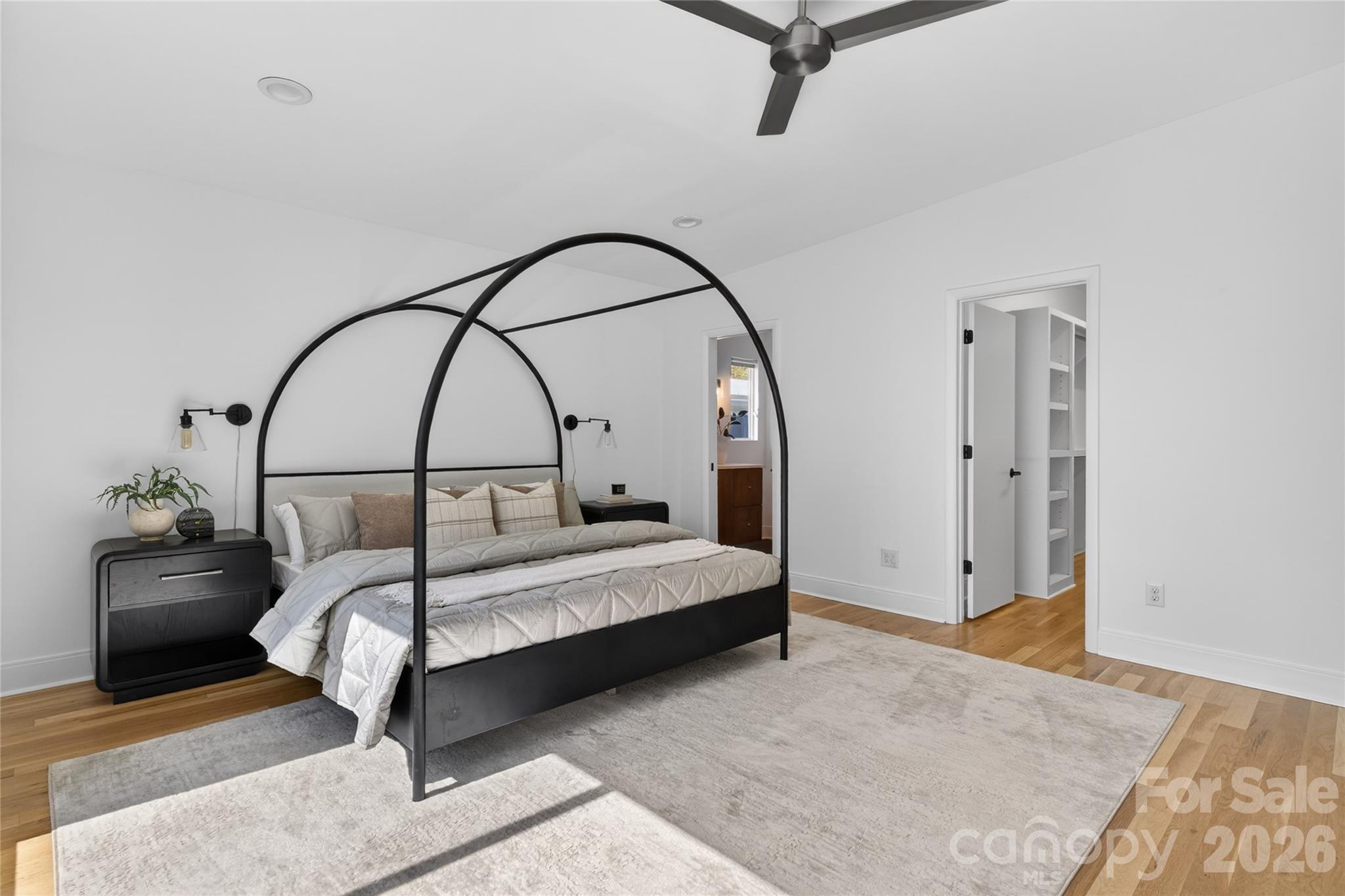 4438 Raney Way Charlotte, NC 28205 - Photo 19 of 34 a bedroom with a bed and a potted plant on dresser