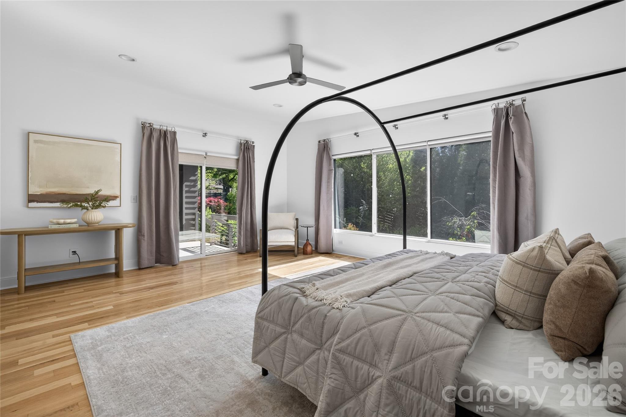 4438 Raney Way Charlotte, NC 28205 - Photo 21 of 34 a bed sitting in a spacious bedroom next to a window