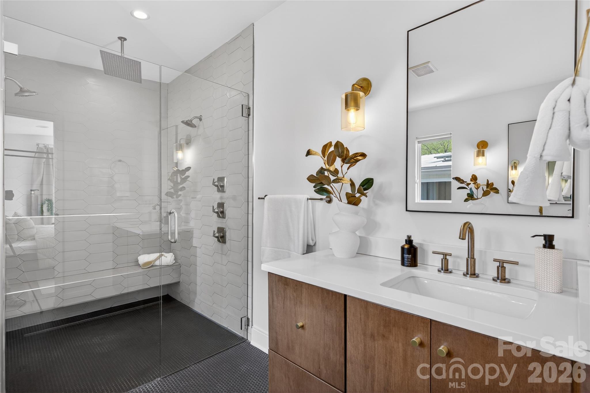 4438 Raney Way Charlotte, NC 28205 - Photo 22 of 34 a bathroom with a tub shower and sink