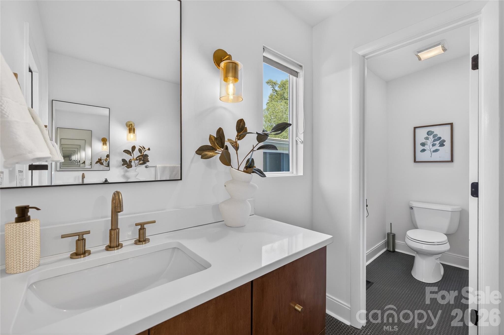 4438 Raney Way Charlotte, NC 28205 - Photo 23 of 34 a bathroom with a sink toilet and mirror
