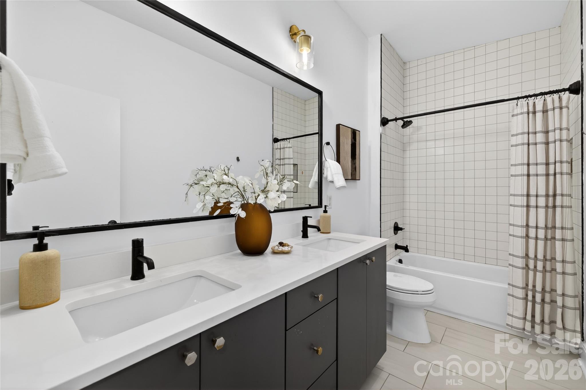 4438 Raney Way Charlotte, NC 28205 - Photo 25 of 34 a bathroom with a sink and a mirror