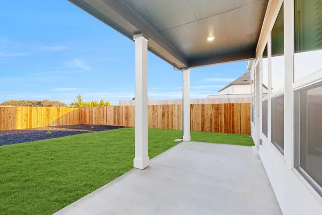 a view of a back yard of the house