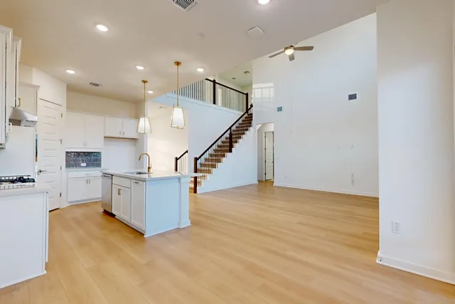 a view of kitchen and kitchen with wooden floor