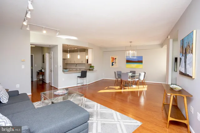 a dining room with furniture and wooden floor