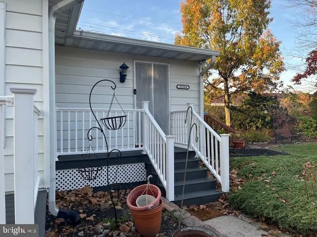 a view of a house with wooden fence