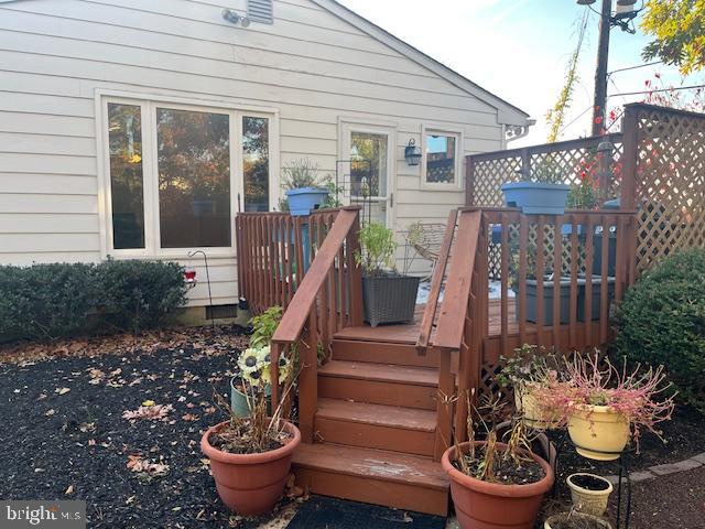 2110 Church Road, Unit B Cinnaminson, NJ 08077 - Photo 13 of 15 a view of a balcony with chair and potted plants